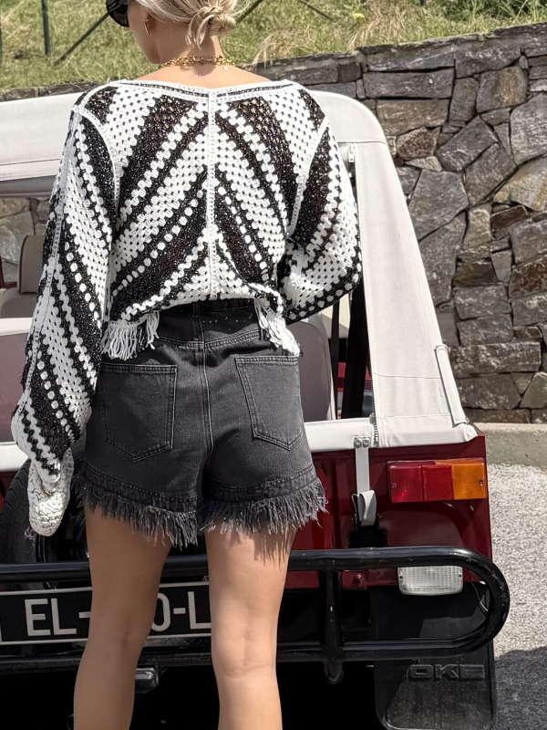 Short en jean noir à franges