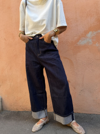 Dark blue jeans with turned-up hem