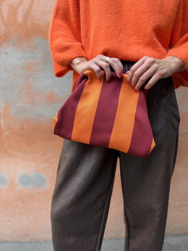 Orange/burgundy striped clutch