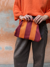 Orange/burgundy striped clutch
