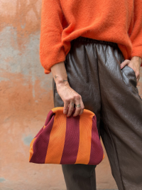Orange/burgundy striped clutch